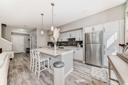 220-7 Westpark Common Sw, Calgary, AB - Indoor Photo Showing Kitchen With Stainless Steel Kitchen With Upgraded Kitchen