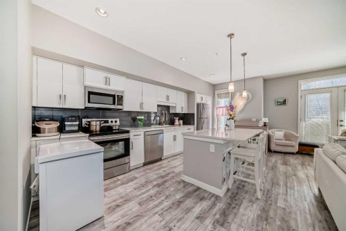 220-7 Westpark Common Sw, Calgary, AB - Indoor Photo Showing Kitchen With Stainless Steel Kitchen