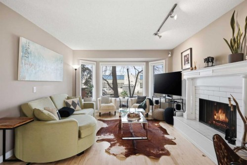 2712 22 Street Sw, Calgary, AB - Indoor Photo Showing Living Room With Fireplace