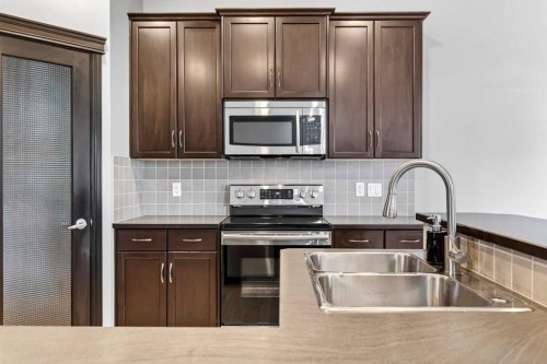 43 Heritage Hill, Cochrane, AB - Indoor Photo Showing Kitchen With Double Sink