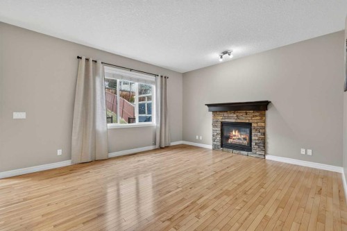 43 Heritage Hill, Cochrane, AB - Indoor Photo Showing Living Room With Fireplace
