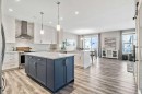 75 Sundown Way, Cochrane, AB  - Indoor Photo Showing Kitchen With Upgraded Kitchen 