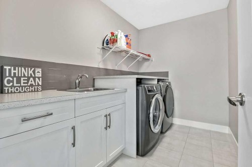 75 Sundown Way, Cochrane, AB - Indoor Photo Showing Laundry Room