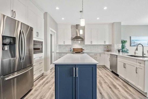 75 Sundown Way, Cochrane, AB - Indoor Photo Showing Kitchen With Upgraded Kitchen