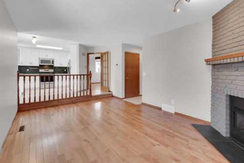 260 Hawkwood Boulevard Nw, Calgary, AB - Indoor With Fireplace