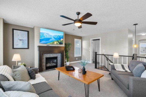 809 Canoe Green Sw, Airdrie, AB - Indoor Photo Showing Living Room With Fireplace