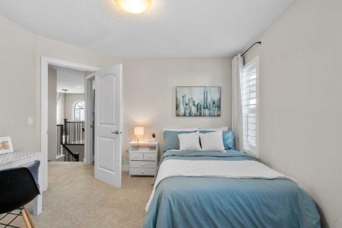 809 Canoe Green Sw, Airdrie, AB - Indoor Photo Showing Bedroom