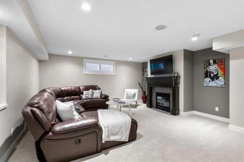 809 Canoe Green Sw, Airdrie, AB - Indoor With Fireplace