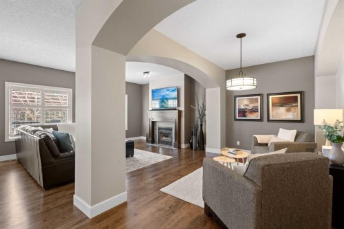 809 Canoe Green Sw, Airdrie, AB - Indoor Photo Showing Living Room With Fireplace