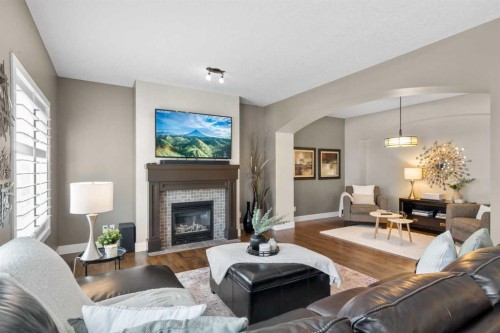 809 Canoe Green Sw, Airdrie, AB - Indoor Photo Showing Living Room With Fireplace