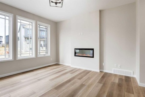 26 Alpine Gardens Sw, Calgary, AB - Indoor With Fireplace