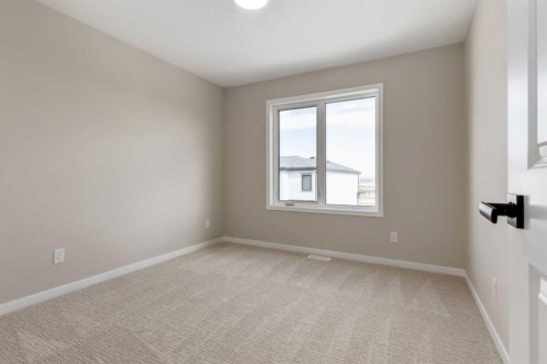 26 Alpine Gardens Sw, Calgary, AB - Indoor Photo Showing Other Room