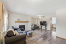 63 Anaheim Crescent Ne, Calgary, AB  - Indoor Photo Showing Living Room With Fireplace 