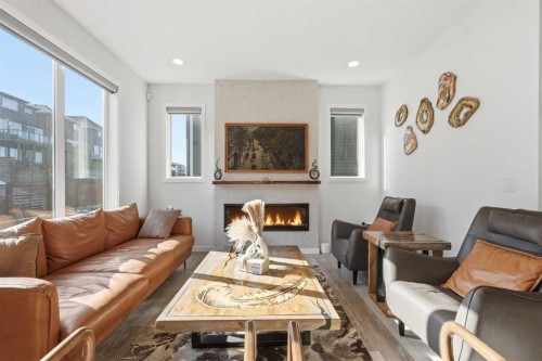 260 Lucas Way Nw, Calgary, AB - Indoor Photo Showing Living Room With Fireplace