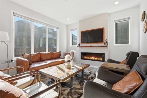 260 Lucas Way Nw, Calgary, AB - Indoor Photo Showing Living Room With Fireplace