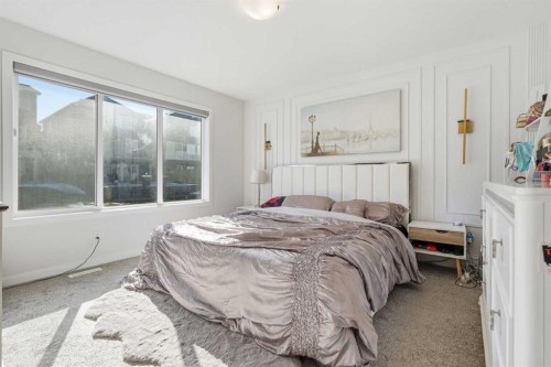 260 Lucas Way Nw, Calgary, AB - Indoor Photo Showing Bedroom