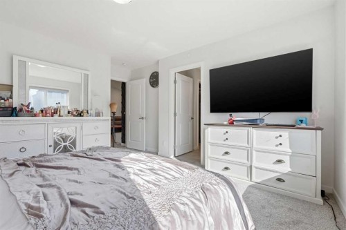 260 Lucas Way Nw, Calgary, AB - Indoor Photo Showing Bedroom