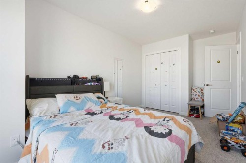 260 Lucas Way Nw, Calgary, AB - Indoor Photo Showing Bedroom