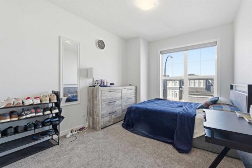 260 Lucas Way Nw, Calgary, AB - Indoor Photo Showing Bedroom