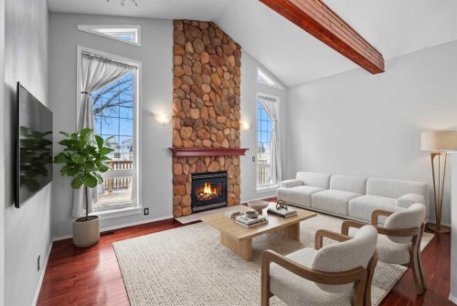 14700 Mt Mckenzie Drive Se, Calgary, AB - Indoor Photo Showing Living Room With Fireplace