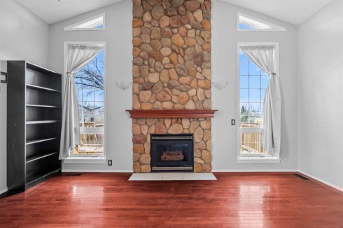 14700 Mt Mckenzie Drive Se, Calgary, AB - Indoor Photo Showing Living Room With Fireplace