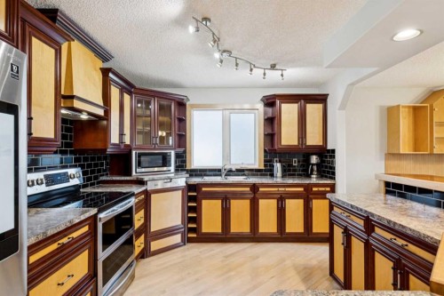 95 Mchugh Road Ne, Calgary, AB - Indoor Photo Showing Kitchen With Double Sink