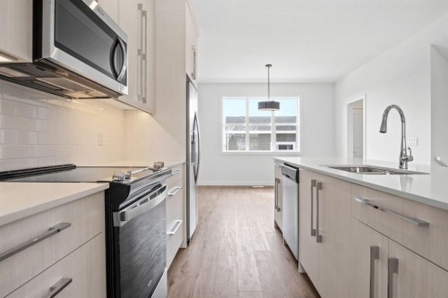 277 Dawson Way, Chestermere, AB - Indoor Photo Showing Kitchen With Double Sink With Upgraded Kitchen