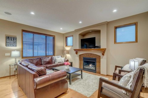 676 Auburn Bay Boulevard Se, Calgary, AB - Indoor Photo Showing Living Room With Fireplace