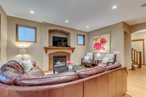 676 Auburn Bay Boulevard Se, Calgary, AB - Indoor Photo Showing Living Room With Fireplace