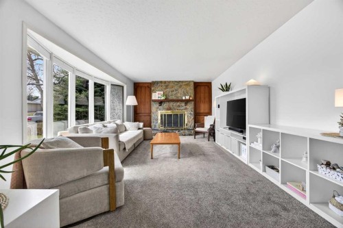 1232 40 Avenue Nw, Calgary, AB - Indoor Photo Showing Living Room With Fireplace