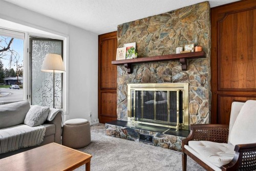 1232 40 Avenue Nw, Calgary, AB - Indoor Photo Showing Living Room With Fireplace