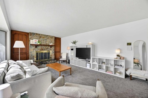 1232 40 Avenue Nw, Calgary, AB - Indoor Photo Showing Living Room With Fireplace