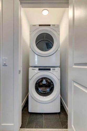 317-8235 8 Avenue Sw, Calgary, AB - Indoor Photo Showing Laundry Room