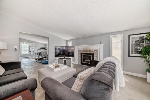 5519 Buckthorn Road Nw, Calgary, AB - Indoor Photo Showing Living Room With Fireplace