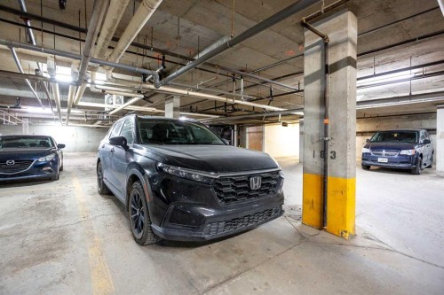216-5115 Richard Road Sw, Calgary, AB - Indoor Photo Showing Garage