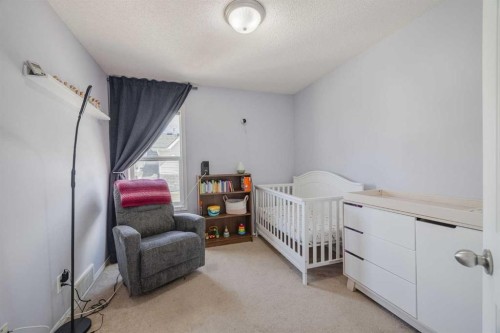 322 Mckenzie Towne Link Se, Calgary, AB - Indoor Photo Showing Bedroom