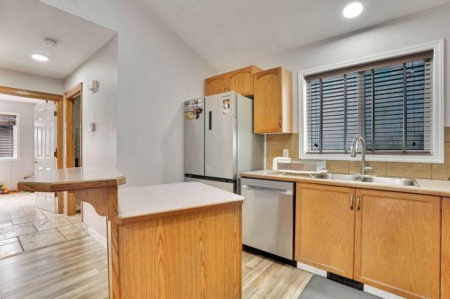 4 Martin Crossing Bay Ne, Calgary, AB - Indoor Photo Showing Kitchen With Double Sink