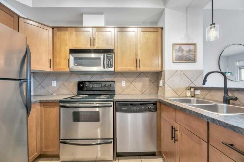 13-148 Rockyledge View Nw, Calgary, AB - Indoor Photo Showing Kitchen With Double Sink