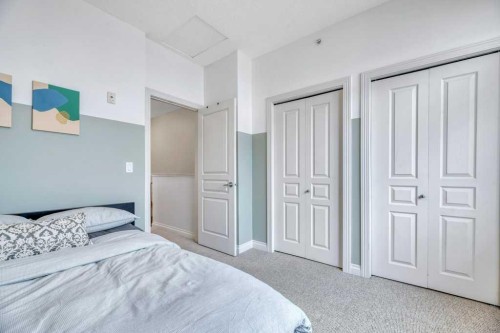 13-148 Rockyledge View Nw, Calgary, AB - Indoor Photo Showing Bedroom