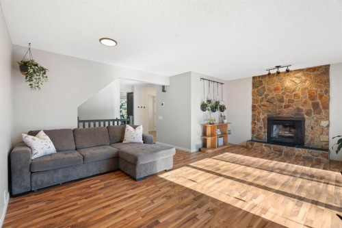 48 Midpark Gardens Se, Calgary, AB - Indoor Photo Showing Living Room With Fireplace