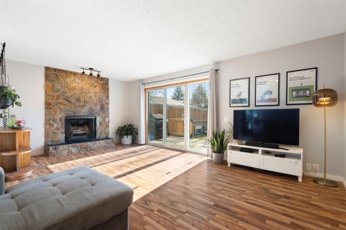 48 Midpark Gardens Se, Calgary, AB - Indoor Photo Showing Living Room With Fireplace