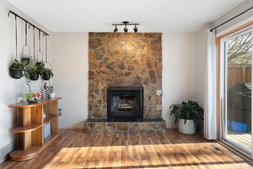 48 Midpark Gardens Se, Calgary, AB - Indoor Photo Showing Living Room With Fireplace