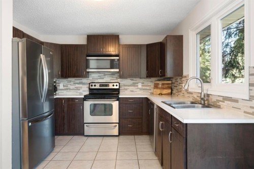 48 Midpark Gardens Se, Calgary, AB - Indoor Photo Showing Kitchen With Stainless Steel Kitchen With Double Sink