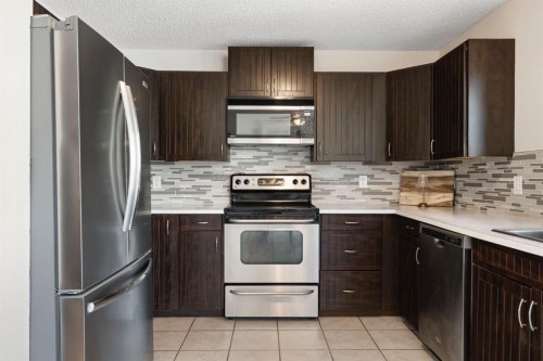 48 Midpark Gardens Se, Calgary, AB - Indoor Photo Showing Kitchen With Stainless Steel Kitchen