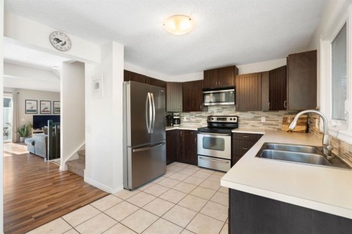 48 Midpark Gardens Se, Calgary, AB - Indoor Photo Showing Kitchen With Stainless Steel Kitchen With Double Sink