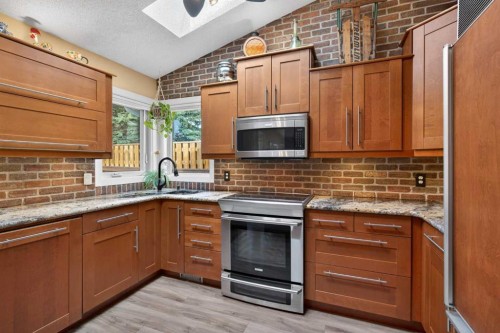 1486 Sunwood Road Se, Calgary, AB - Indoor Photo Showing Kitchen