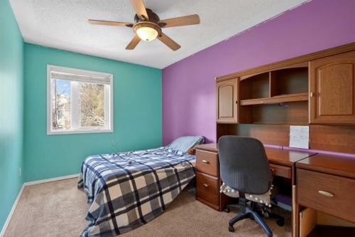1486 Sunwood Road Se, Calgary, AB - Indoor Photo Showing Bedroom