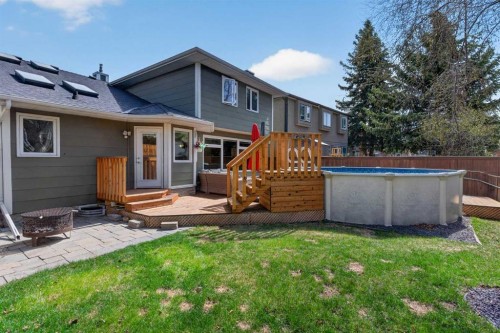 1486 Sunwood Road Se, Calgary, AB - Outdoor With Above Ground Pool