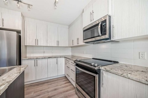 154 Sage Hill Grove Nw, Calgary, AB - Indoor Photo Showing Kitchen With Upgraded Kitchen