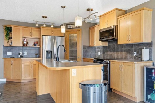 202 New Brighton Manor Se, Calgary, AB - Indoor Photo Showing Kitchen With Double Sink